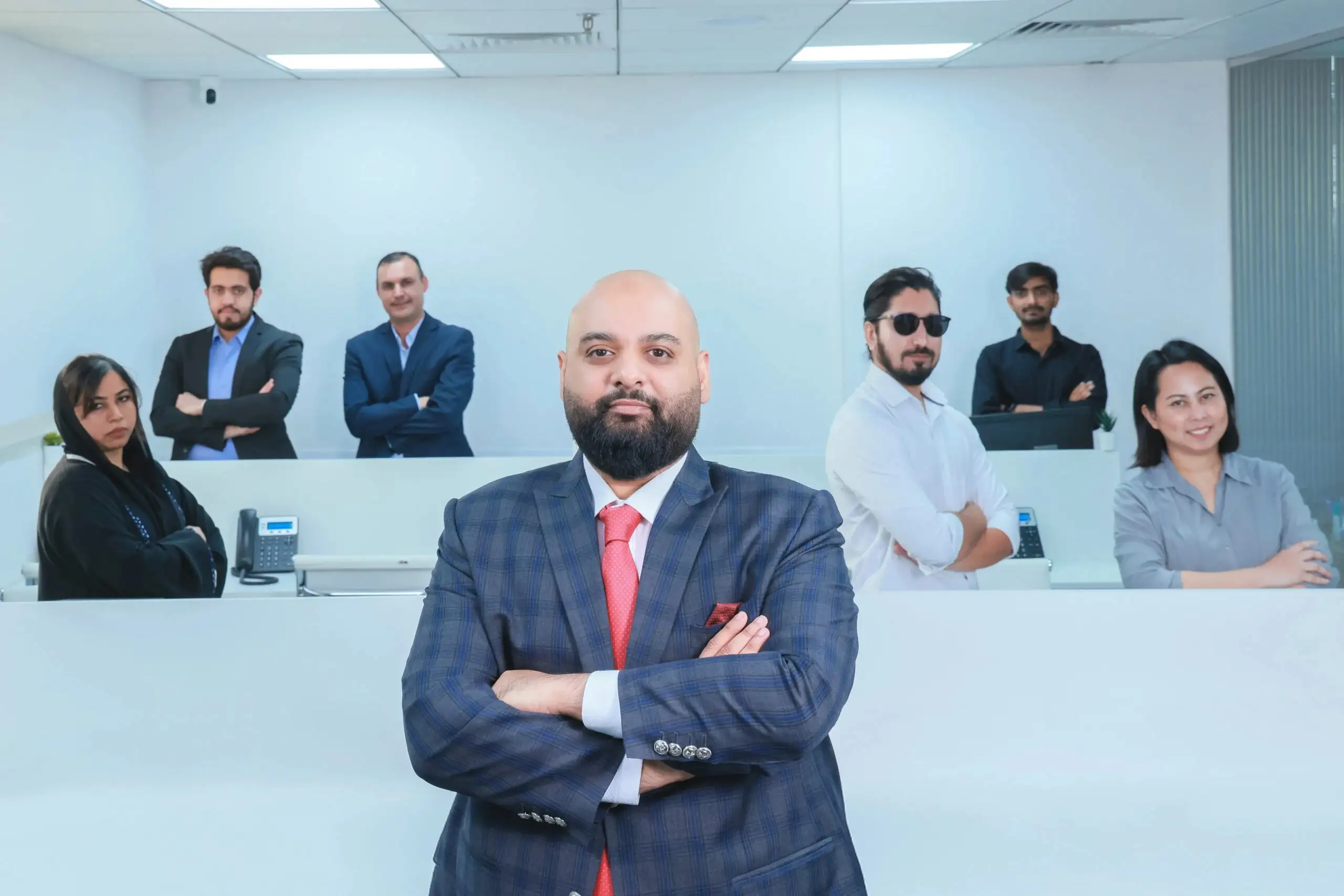 A professional team standing in a modren office with team leader
