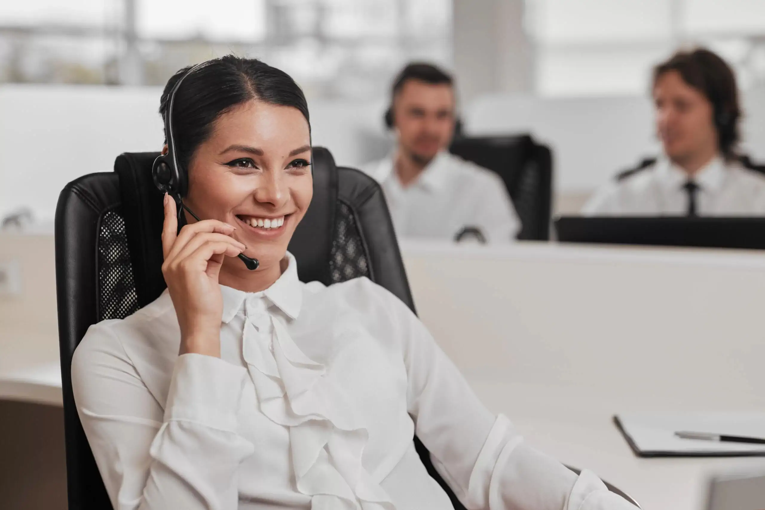 Employee talking on phone with someone in office