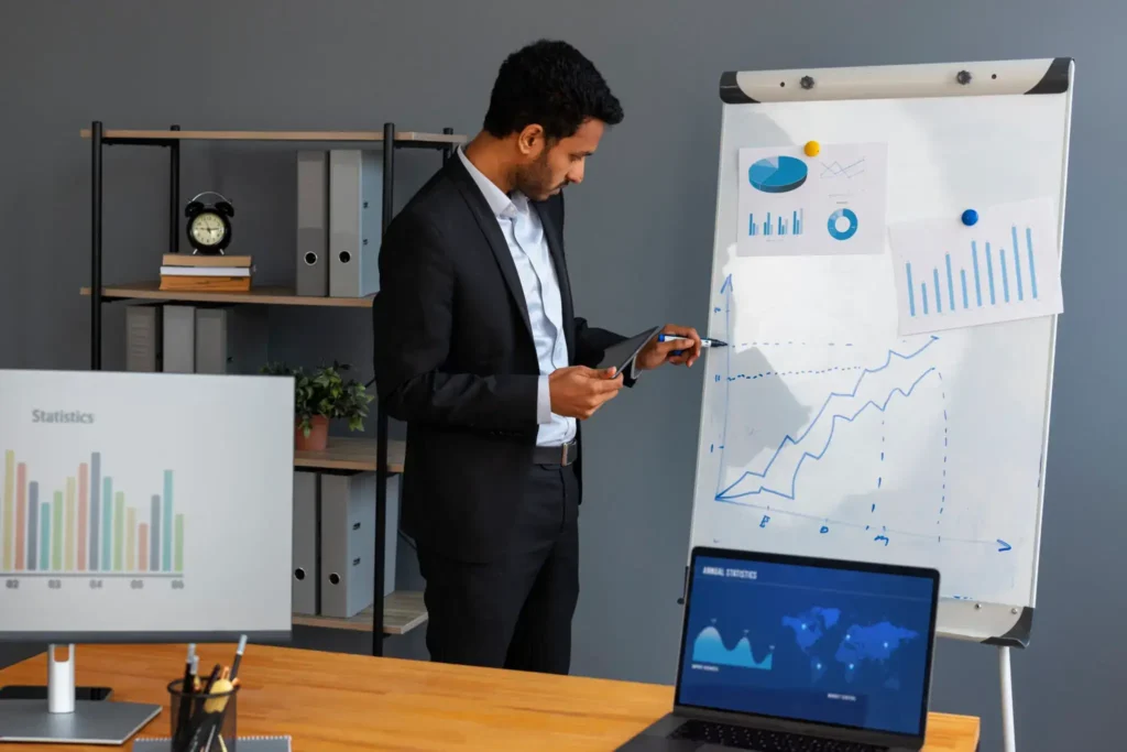 Business professional analyzing growth charts and financial data on presentation board in office.