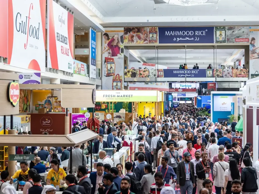 Exhibition Staff Gulfood Dubai managing busy trade show crowd at food exhibition hall