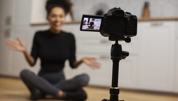 full-shot-blurry-woman-with-camera