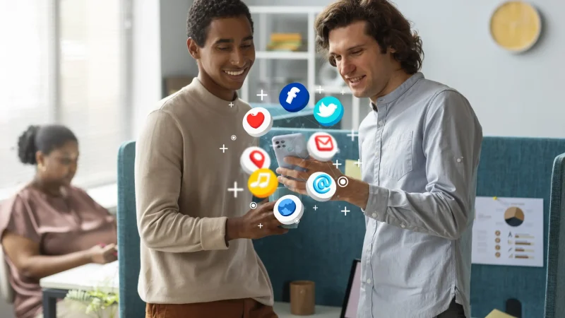 medium-shot-men-holding-smartphone-scaled